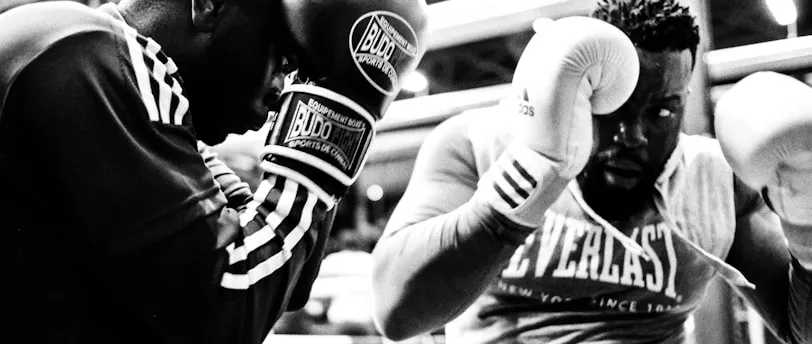 two men wearing boxing gloves