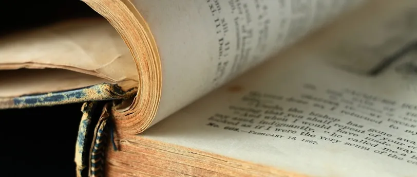 an open book laying on top of an open book