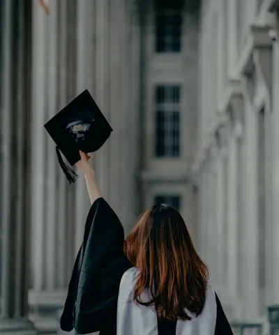 a woman in a graduation cap and gown